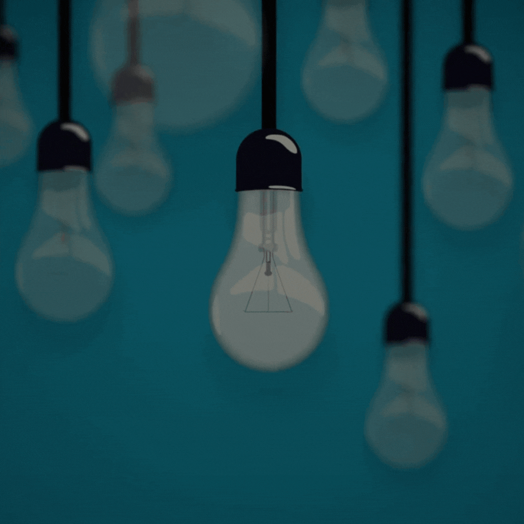 Zooming in on a hanging lightbulb off, then turning on